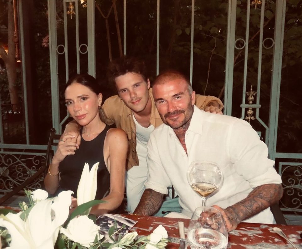 Victoria, David, and Cruz Beckham at dinner.