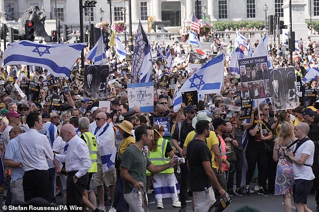 Scuffles have reportedly broken out during a protest calling on the government to do more to free Israeli hostages held captive by Hamas (pictured are some of the campaigners today)
