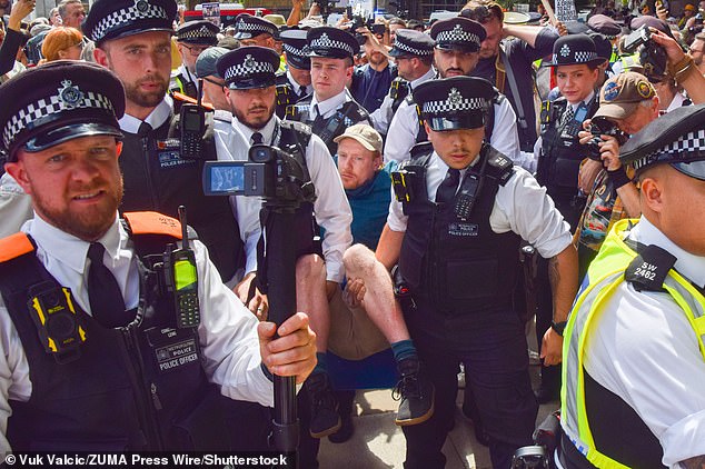 During a day of chaos and farce, Left-wing activists swamped Parliament Square in London yesterday in support of the organisation, which was proscribed by the Government last month as a terrorist group