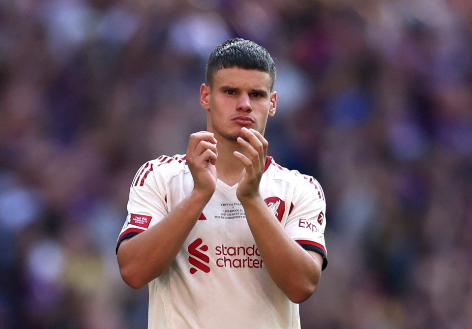 Liverpool's Milos Kerkez applauding after a match.