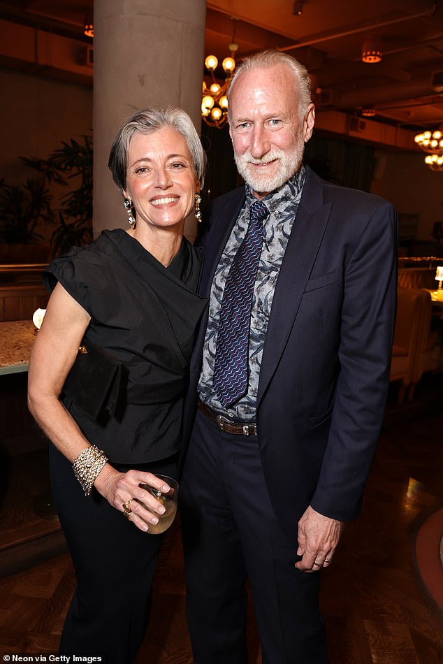 She tied the knot with her second husband, Jim Henson's son Brian (R), in 2010. She was previously married to Sean Connery's son Jason from 1996 to 2002; pictured June 2 in LA