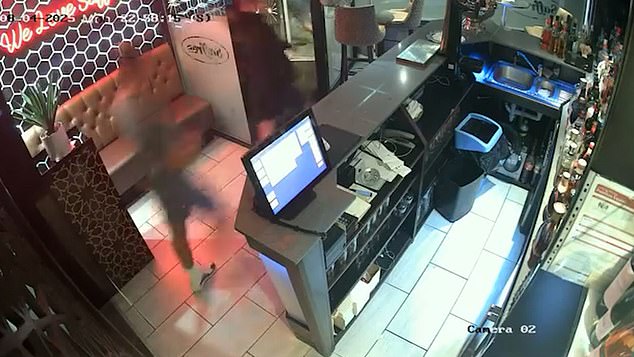 The table of diners then walk past the bar at the front of restaurant as they make a hasty escape