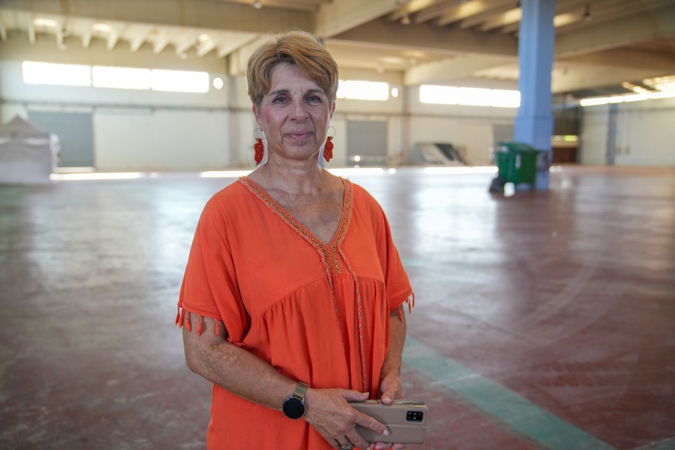 Deputy Mayor Eleni Zervoudakis in an empty exhibition hall.