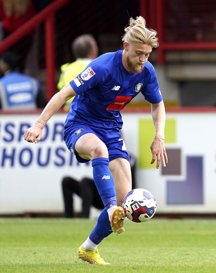 Photo of Luke Armstrong of Harrogate Town playing soccer.