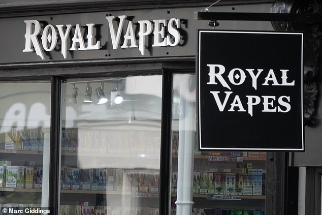A Royal Vapes store on the High Street beside buildings where high street retailers have closed down