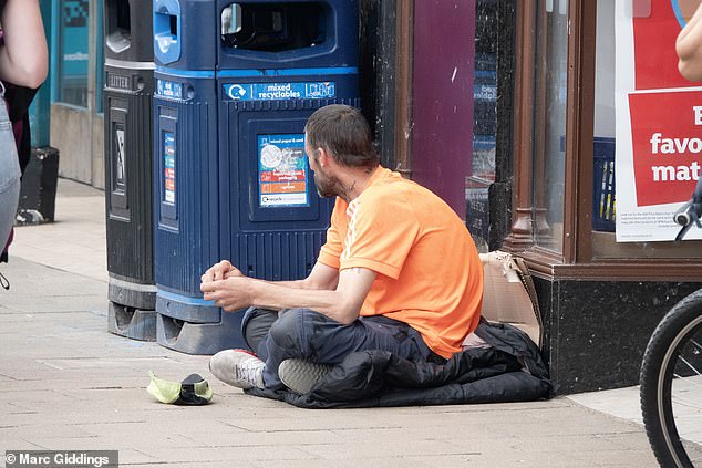 Jack Wills, Fraser Hart, and The Body Shop have all closed doors since the beginning of last year. Pictured: A man begging outside the Sainsbury's