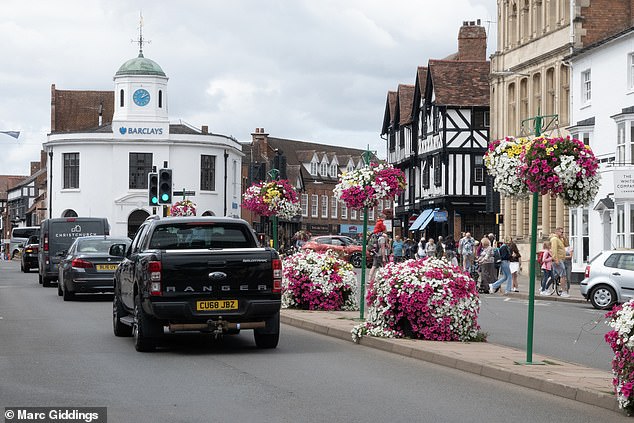 The town centre is adorned with historic buildings and beautiful floral arrangements but also has rows of empty stores