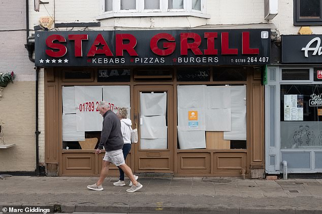 A Star Grill sits vacant with windows covered with sheets of paper. Locals told of how there is 'too much saturation' of the same types of shops
