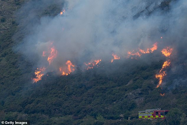 Fire crews underneath the blaze at Arthur's Seat as four crews work to tackle the flames