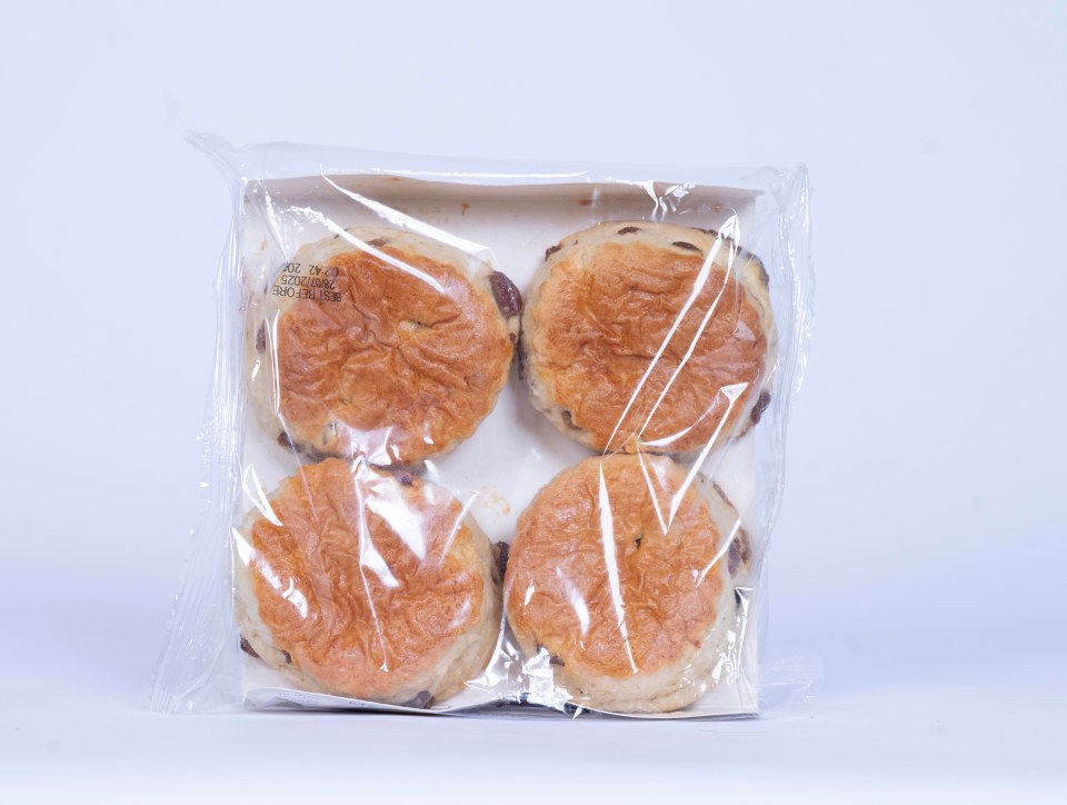 Four raisin scones in a plastic package.