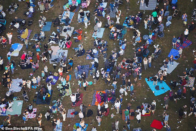 Crowds watched below as hundreds of colourful hot air balloons took to the sky