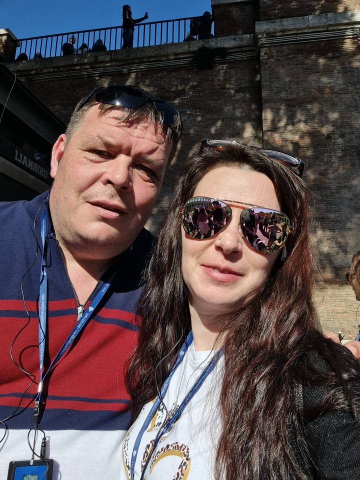 Photo of a couple wearing sunglasses.