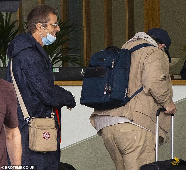 And the brothers were seen laughing and joking as they made their way inside with their luggage ahead of the flight after travelling to Bedfordshire from Liam's £4million home