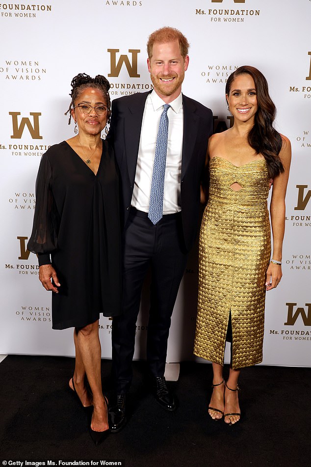 fans have pointed out another reason why Meghan's cake may have been adorned with flowers - as one person revealed it represents the nickname given to her by her mother, Doria Ragland (left)