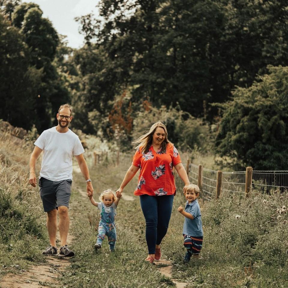 Family walking together outdoors.