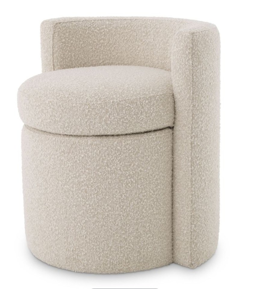 Beige upholstered storage ottoman.