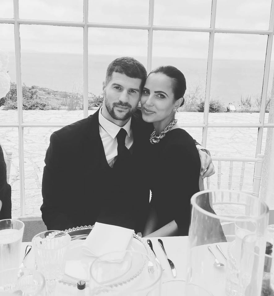 Black and white photo of a couple at a wedding.