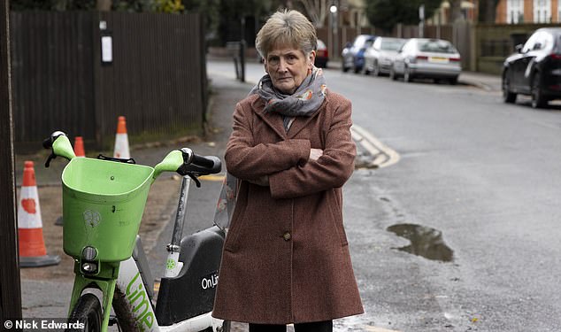 Sally Gibbons, the chair of a Wimbledon residents' association, has raised safety concerns about e-bikes left on her road, but says dedicated spaces will only work if backed by legislation