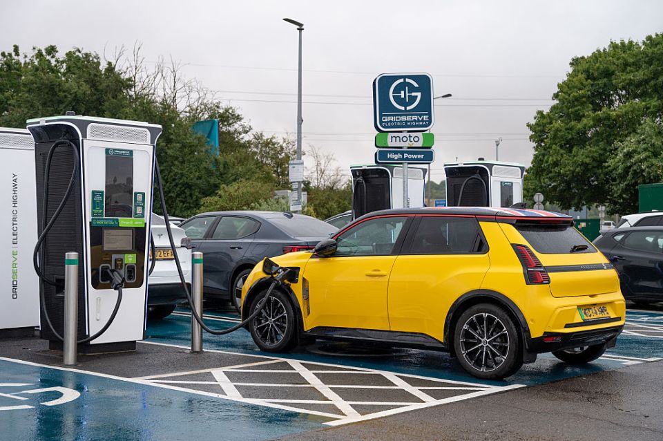 Yellow electric car charging at a Gridserve Electric Highway station.