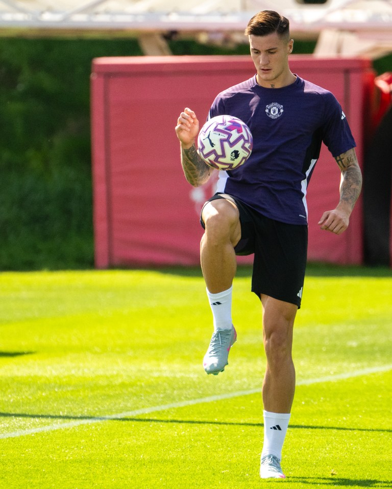 Benjamin Sesko of Manchester United juggling a soccer ball during training.