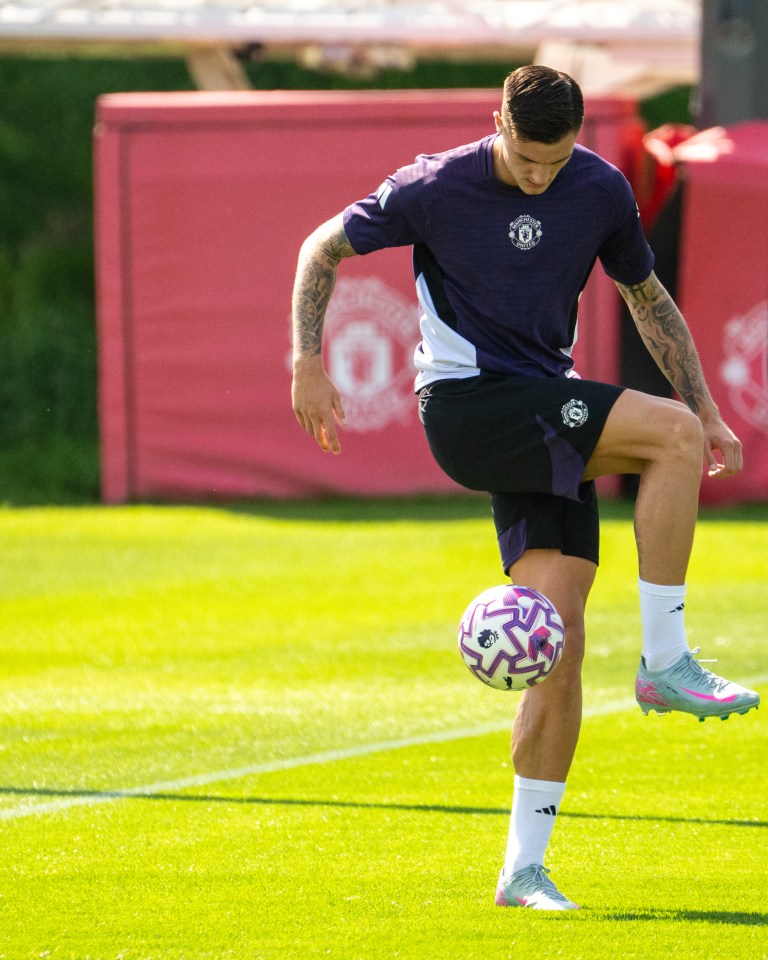 Benjamin Sesko of Manchester United juggling a soccer ball during training.