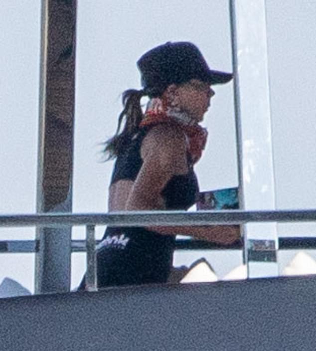 Meanwhile Victoria wore a causal black mini dress which hugged her lithe figure and she teamed it with a baseball cap and floral scarf