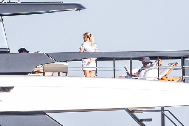 The lavish £16M vessel also has a crew (centre) who were on hand to serve the Beckhams