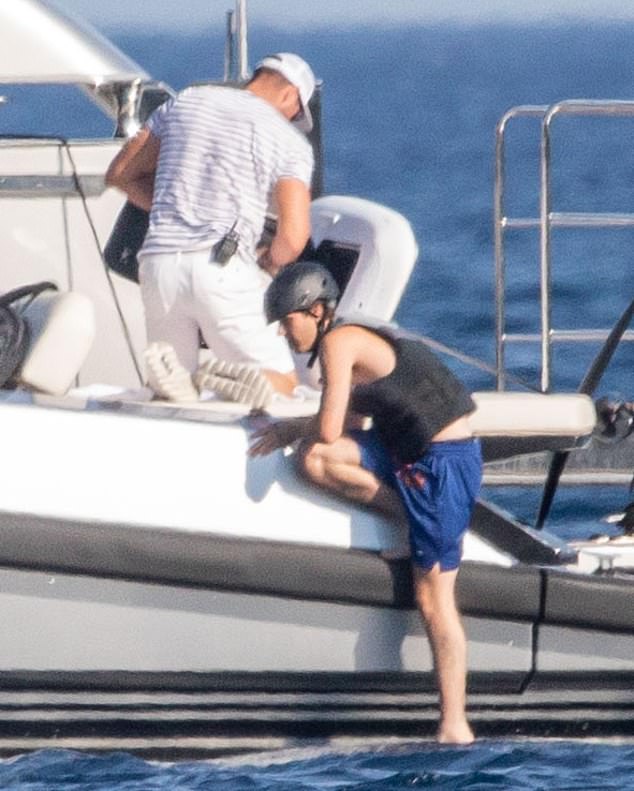 He climbed into the water with ease while Jackie watched from deck
