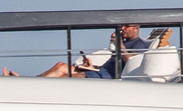 During a break from his paperback the footballer sipped his drink and glanced at his phone
