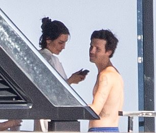 The lovebirds put on a very cosy display on deck