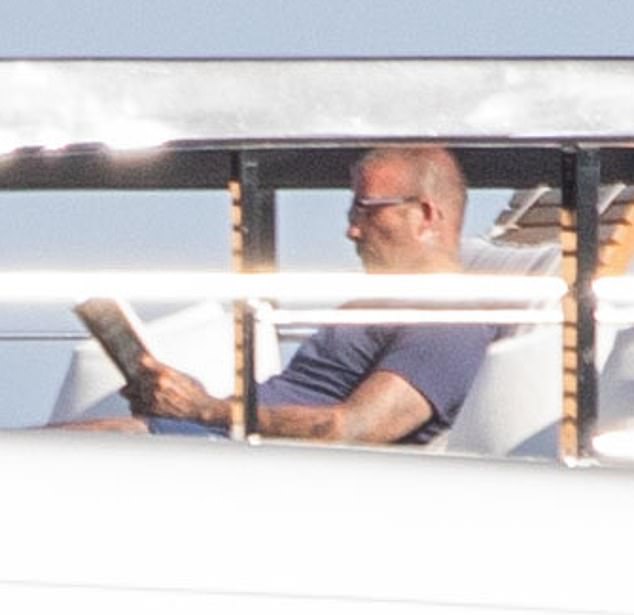 David shielded his eyes from the scorching sun behind shades