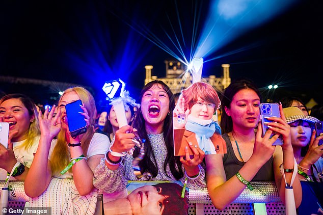 Korean pop music has also been a global phenomenon since it first captured global attention in 2012 with Gangnam Style, by singer-songwriter PSY that topped the charts in more than 30 countries. Pictured: Fans at a concert in Seoul