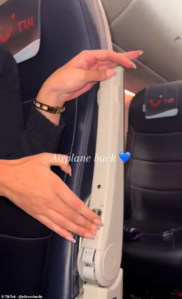 Sliding her hand towards the back underside of the armrest, near the hinge, the UK-based flight attendant pushed a button that released it from its position, allowing it to be pushed back out of the way