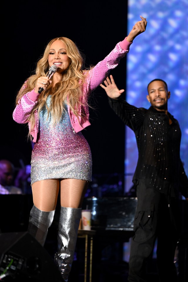 Mariah Carey performing on stage.