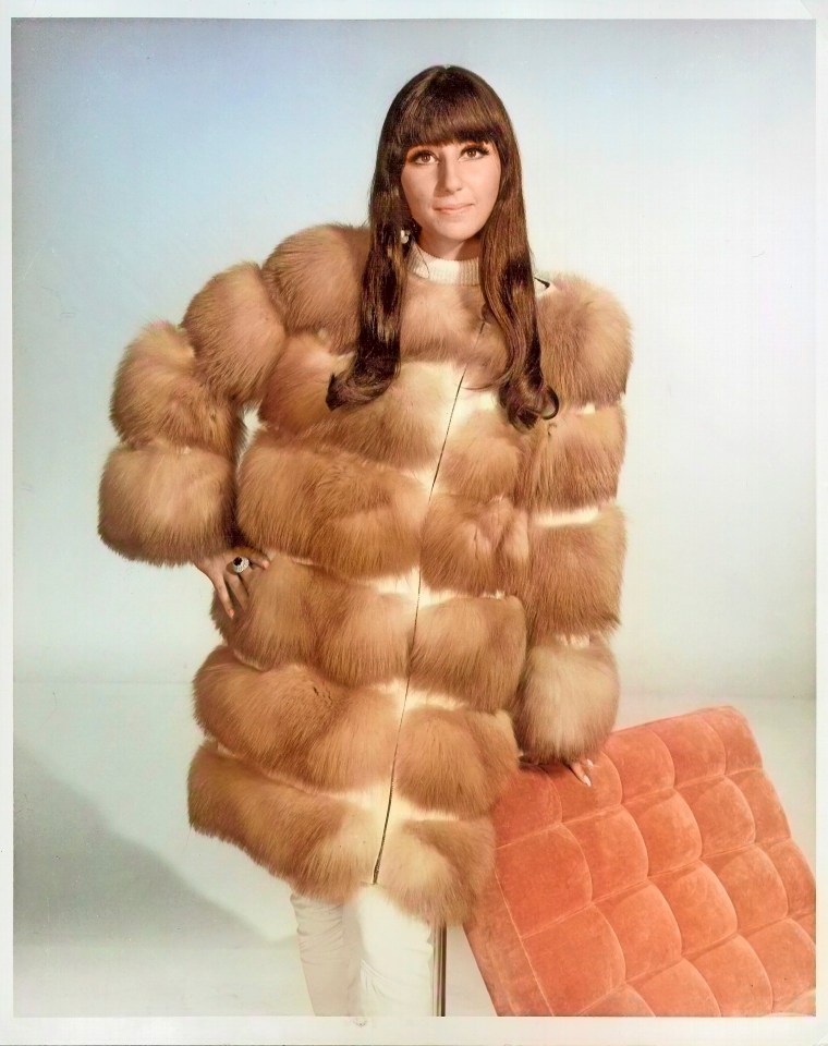 Portrait of Cher wearing a fur coat.