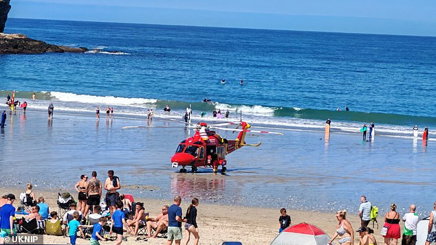 On Sunday at around midday a body thought to be hers was dredged out of the sea at Bedruthan Steps, a scenic coastal stretch between padstow and Newquay, Cornwall., nine minutes' drive from where she was last spotted (Pictured: emergency services at the scene)