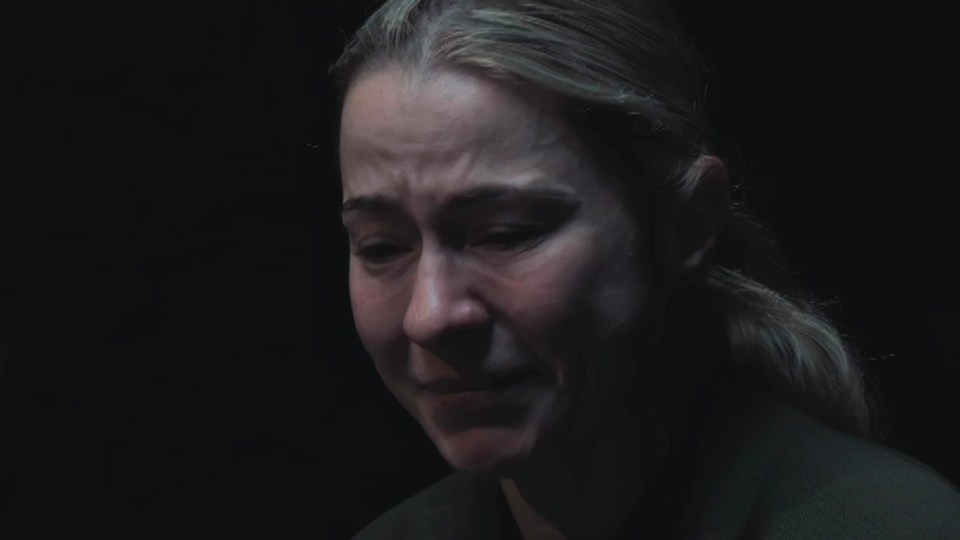 Close-up of a woman crying.