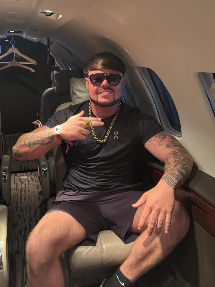 Man in sunglasses on a private jet.