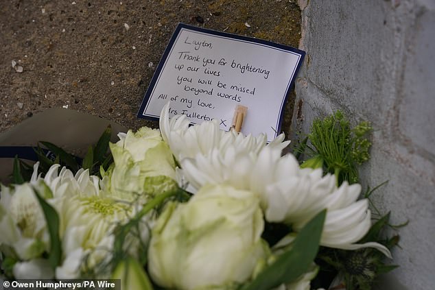 Following his death, Layton's devastated family paid tribute to their 'cheeky, happy lad', in a statement that read: 'From the minute he was born, it was obvious the character he would turn out to be.' Pictured: Floral tributes to Layton left at the scene of his death