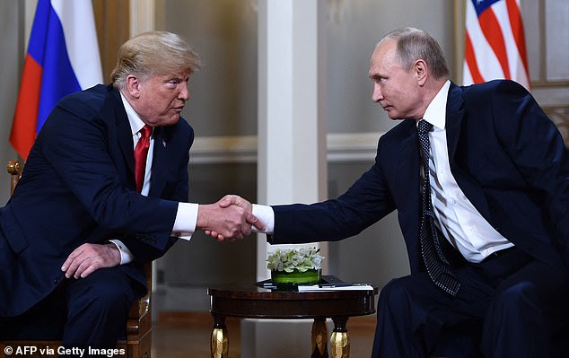 Mr Trump did not criticise Putin for illegally launching his full-scale invasion of Ukraine in February 2022. Pictured: The pair shake hands before a meeting in Helsinki in 2018