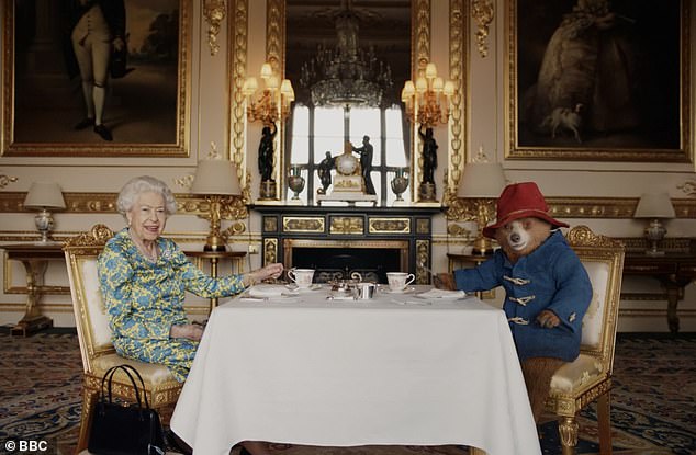 The Queen performed a skit for the BBC's Platinum Party at the Palace, where she and Paddington Bear chatted before she tapped  along to 'We Will Rock You' by Queen to kick start the party and star-studded concert this evening