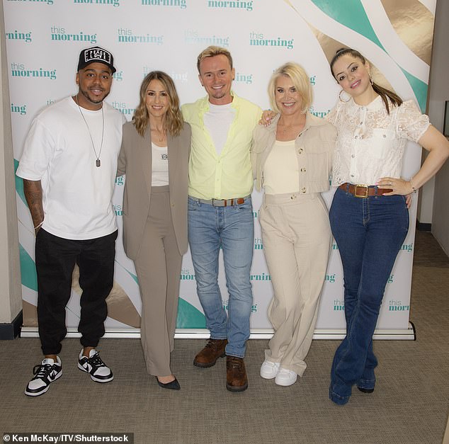 Jon pictured with his former bandmates Bradley McIntosh, Rachel Stevens, Jo O'Meara and Tina Barrett