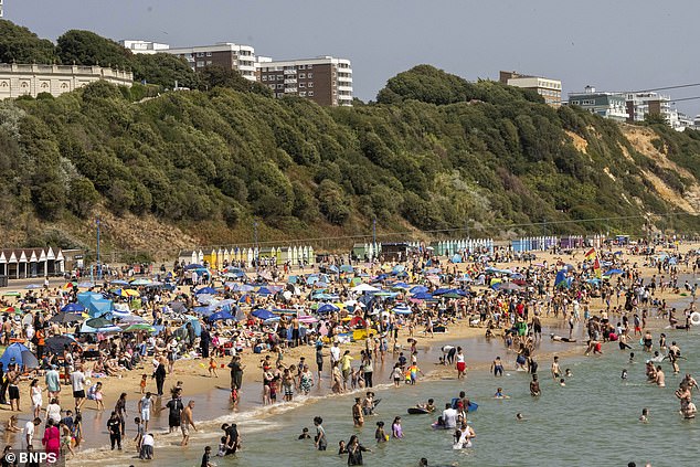 Bournemouth beach full of locals and tourists on Sunday as the warm weather continues in the UK