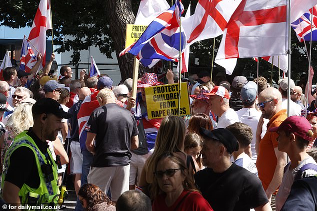 Protestors gather outside the Roundhouse Hotel in Bournemouth on August 9 after it was announced as being used as a migrant hotel