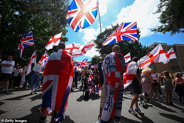 Anti illegal immigration protesters demonstrate outside The Roundhouse hotel on August 9