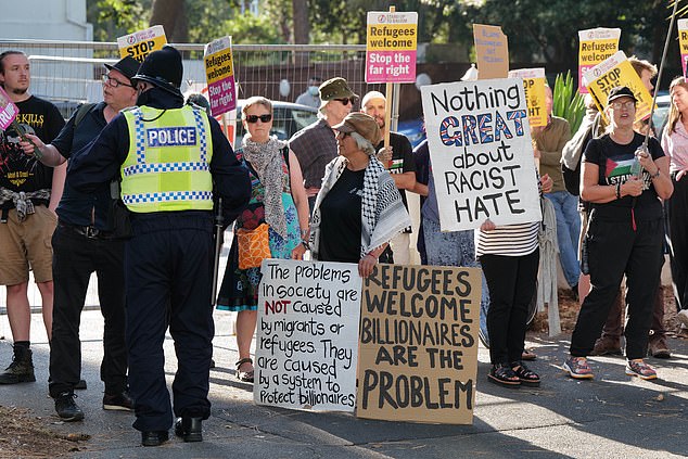 Some pro-immigration activists held signs saying 'refugees welcome' (pictured)