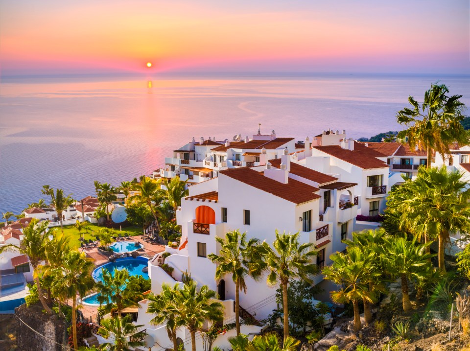 Sunrise over a coastal town in Tenerife.