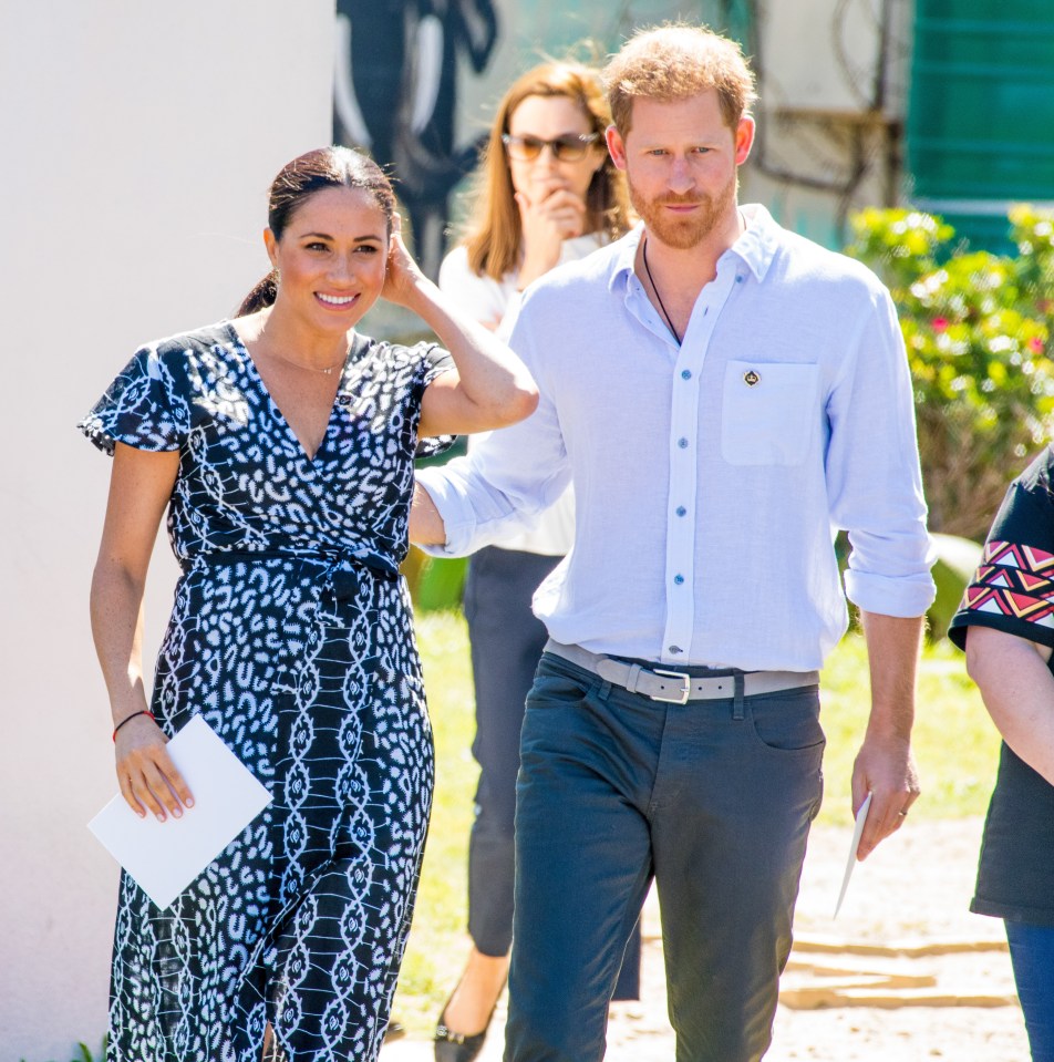 Meghan Markle and Prince Harry walking together.