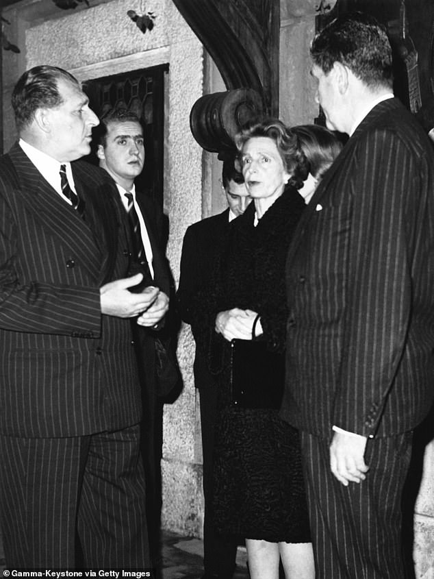 Prince Don Juan of Bourbon, his son Don Juan Carlos, Princess Beatriz Torlonia and her husband Prince Alessandro Torlonia after lunch in a restaurant on the Via Veneto in January 1962 in Rome