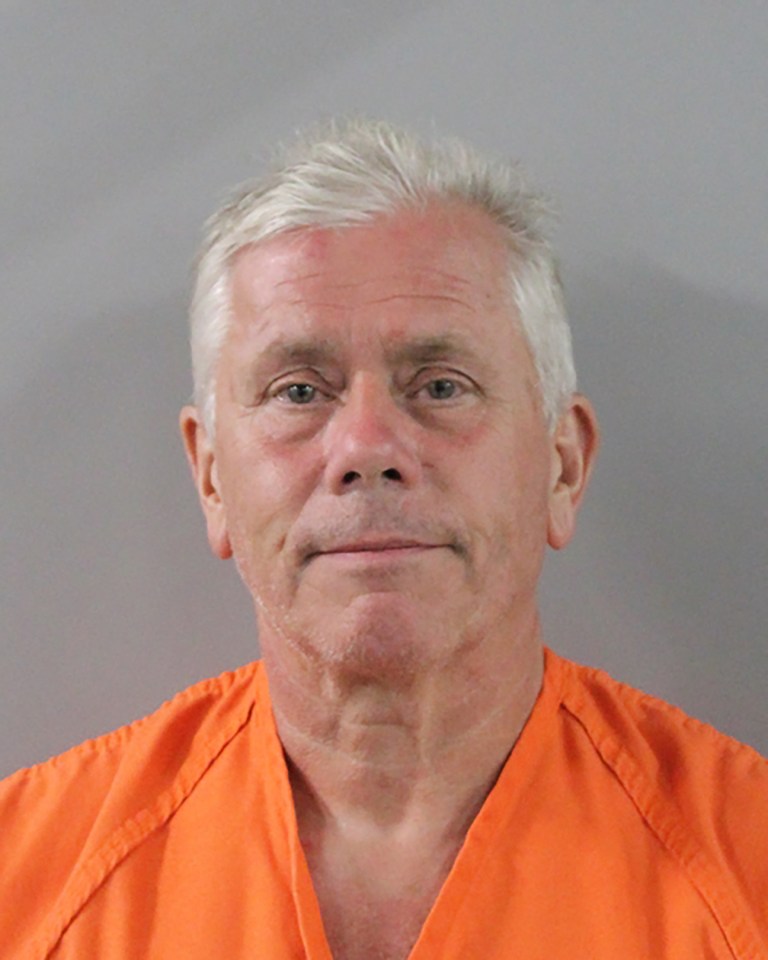 Mugshot of Mark Gibbon, wearing an orange jumpsuit.